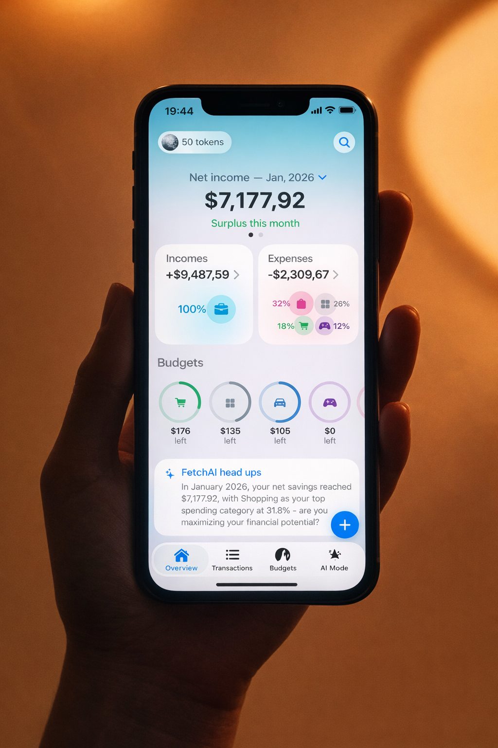 MoneyFetch app screen shown on a phone in hand